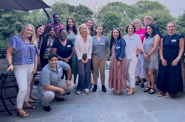 A group of Rowan Center employees and volunteers pose for a picture. 